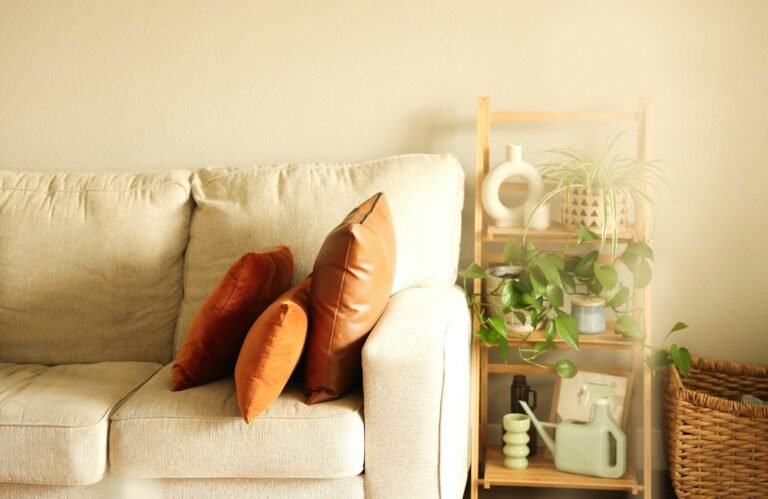 a white couch with two pillows on it